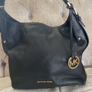Thick black leather Michael Kors shoulder bag.